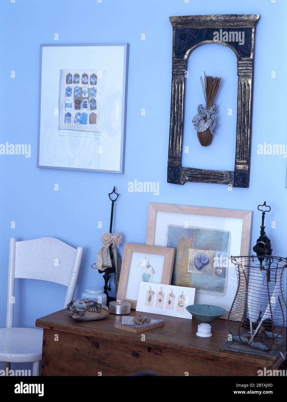 Variety of pictures and picture frames on wall Stock Photo Alamy