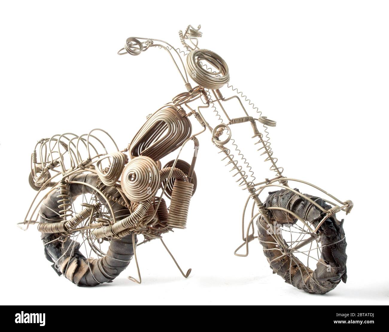 Photo of a detailed hand made wire model of a motorcycle made by a young Malawian near Lake Malawi. All parts are fashioned from various bits of wire Stock Photo