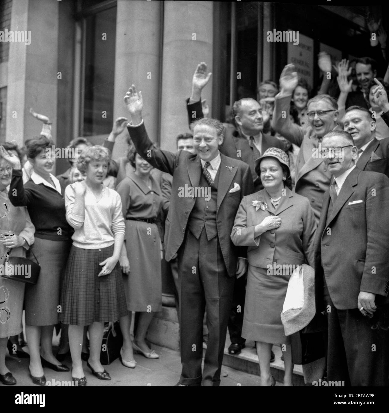 Outside the Labour Partuy Headquarters at Transport House in London, Hugh Gaitskell (centre) leaves with his wife for an 11 day election tour of Britain. With him are Labour Party members Tom Drieberg, Richard Crossman and Morgan Phillips Stock Photo