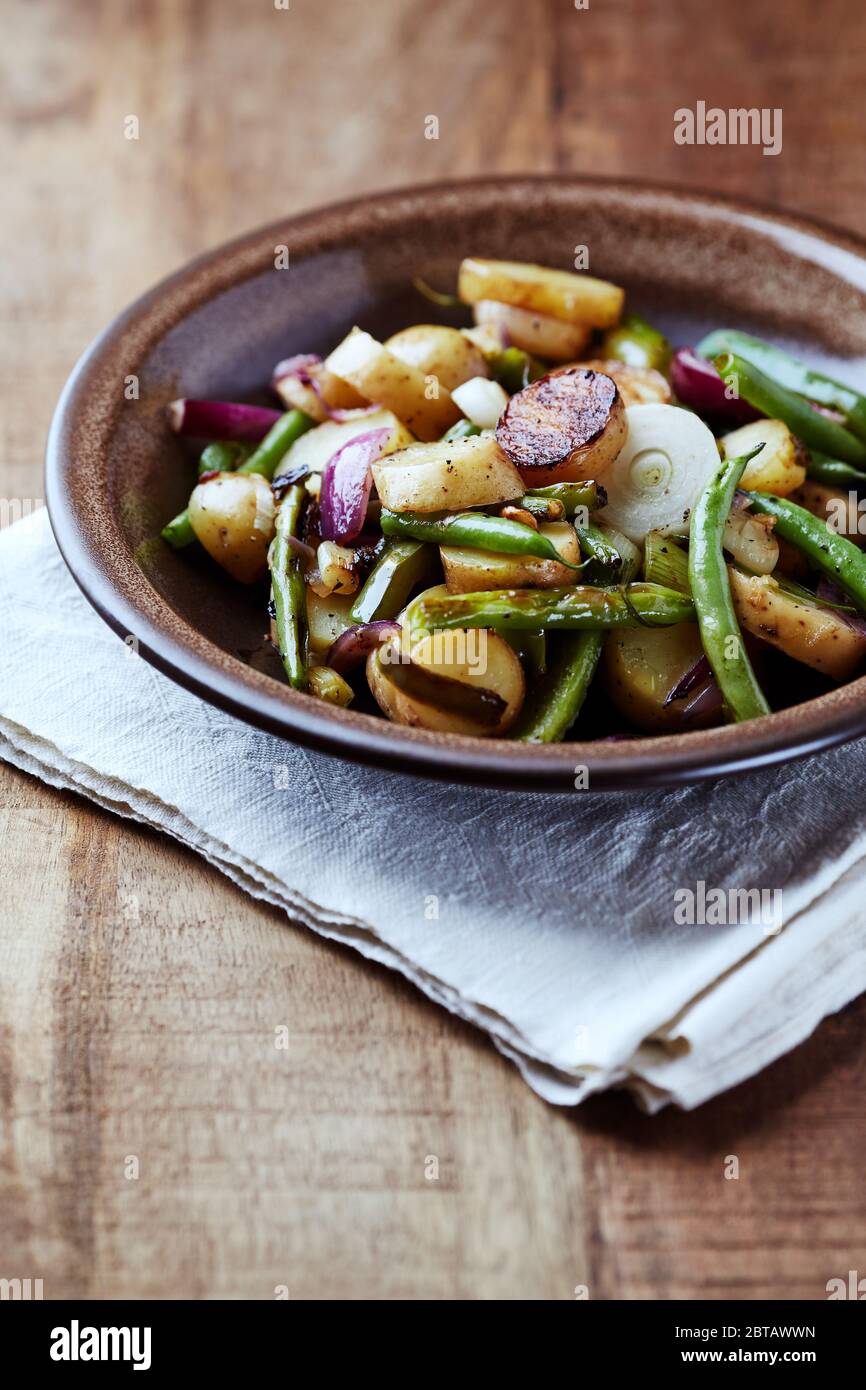 Oven roasted vegetables on rustic wooden background Stock Photo - Alamy