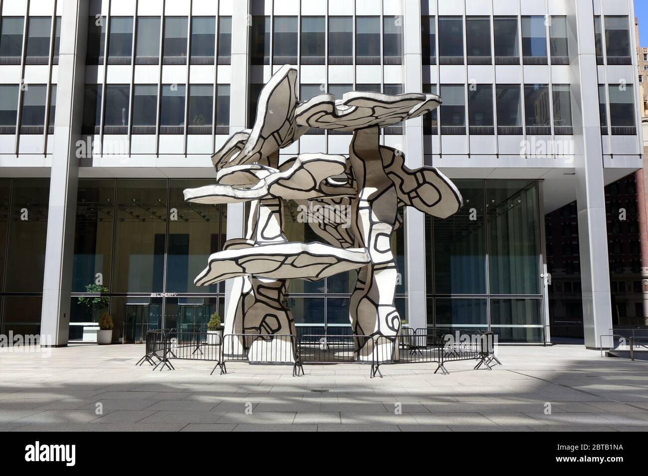 The 'Group of Four Trees' sculpture by Jean Dubuffet surrounded by barricades in front of the former Chase Manhattan Building, 28 Liberty, in New York Stock Photo