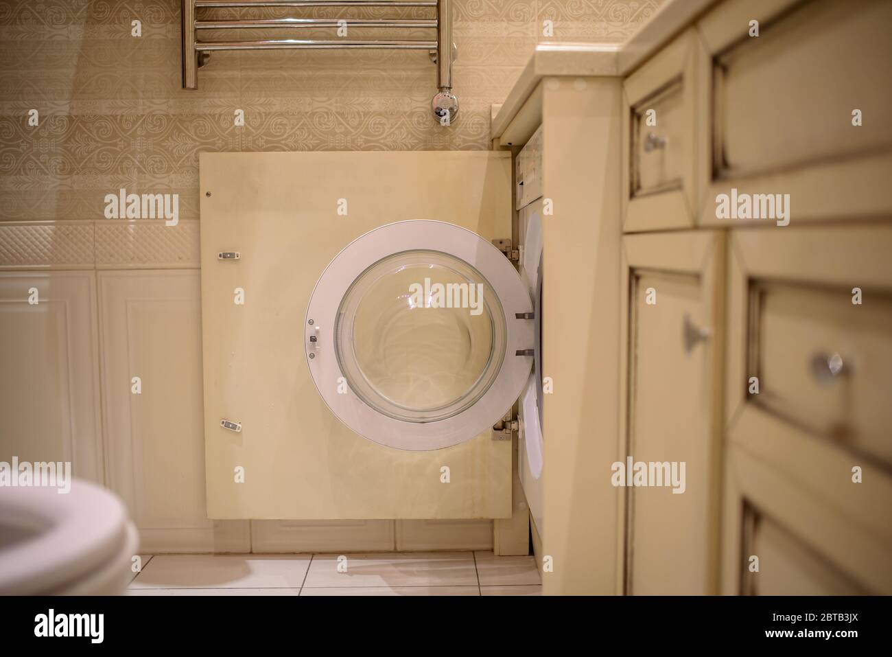 washing machine in bathroom, laundry concept Stock Photo Alamy