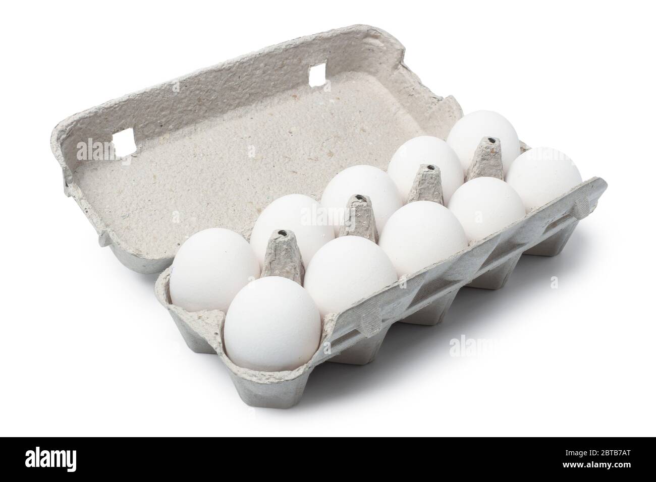 Chicken eggs in a carton isolated on white background Stock Photo - Alamy