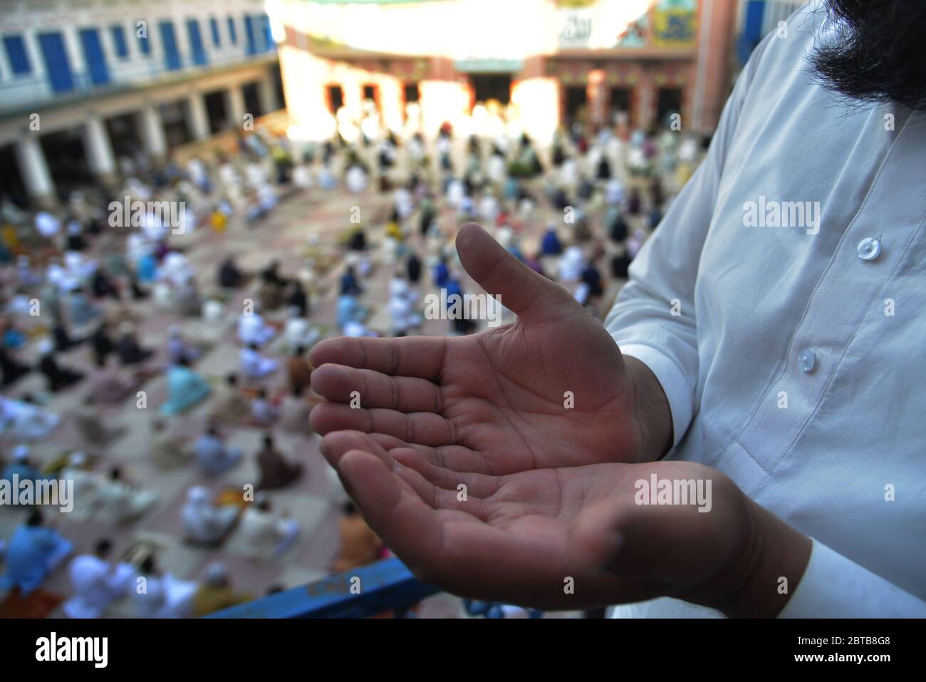 Pakistani faithful Muslims offer Eid al-Fitr prayers at Jamia Naeemia Mosque with SOP's after the government relaxed a weeks-long lockdown that was enforced to help curb the spread of the coronavirus in Lahore. Muslims around the world began marking a sombre Eid al-Fitr on May 24, the end of the fasting month of Ramadan' many under coronavirus lockdown, but lax restrictions offer respite to worshipers in some countries despite fears of skyrocketing infections.a usually joyous three-day celebration that has been significantly toned down as coronavirus cases soar. (Photo by Rana Sajid Hussain/Pa Stock Photo