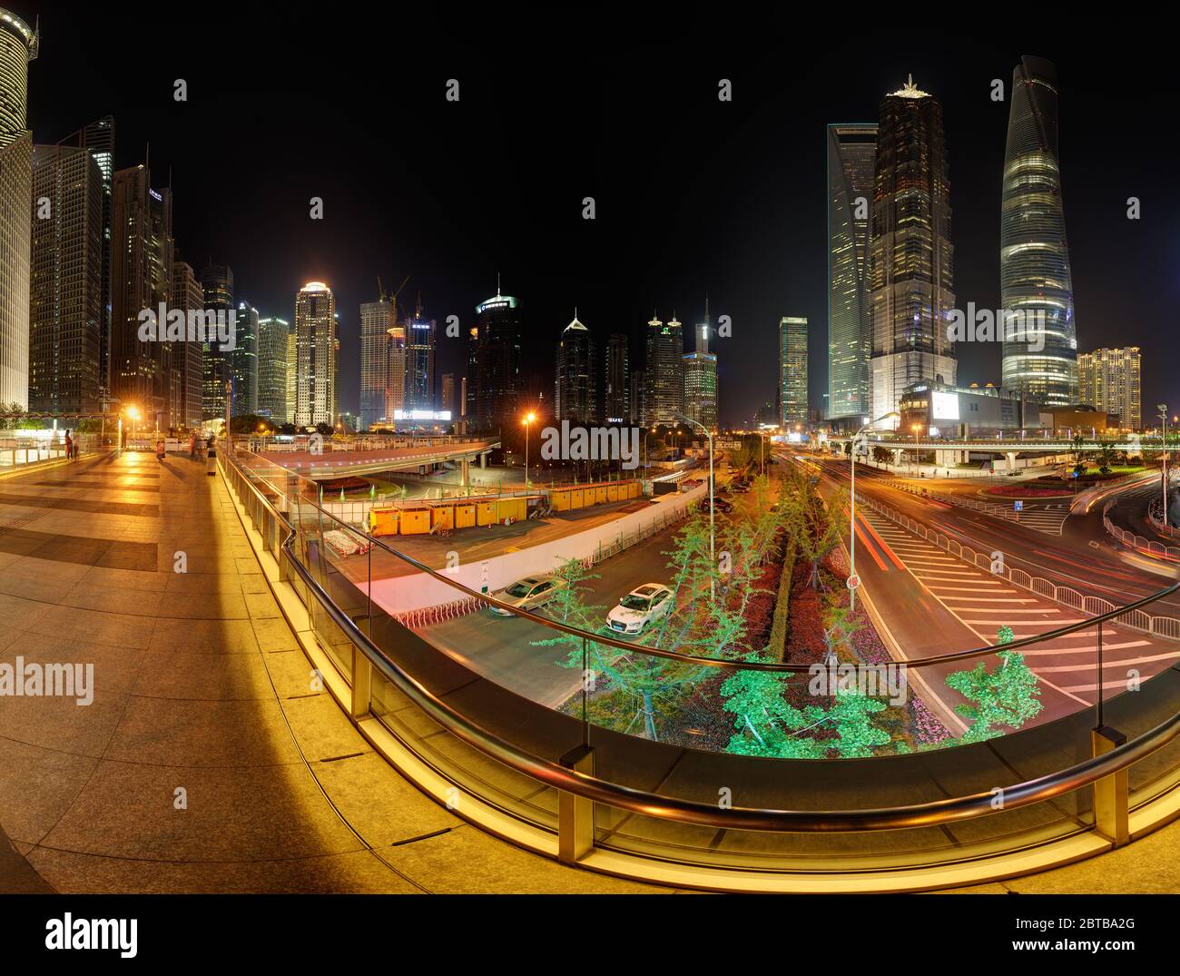 SHANGHAI, CHINA - APRIL 21, 2015: 360 degrees skyline of Pudong financial center by night. Pedestrian, aerial walkway at Lujiazui.Right part,can be co Stock Photo