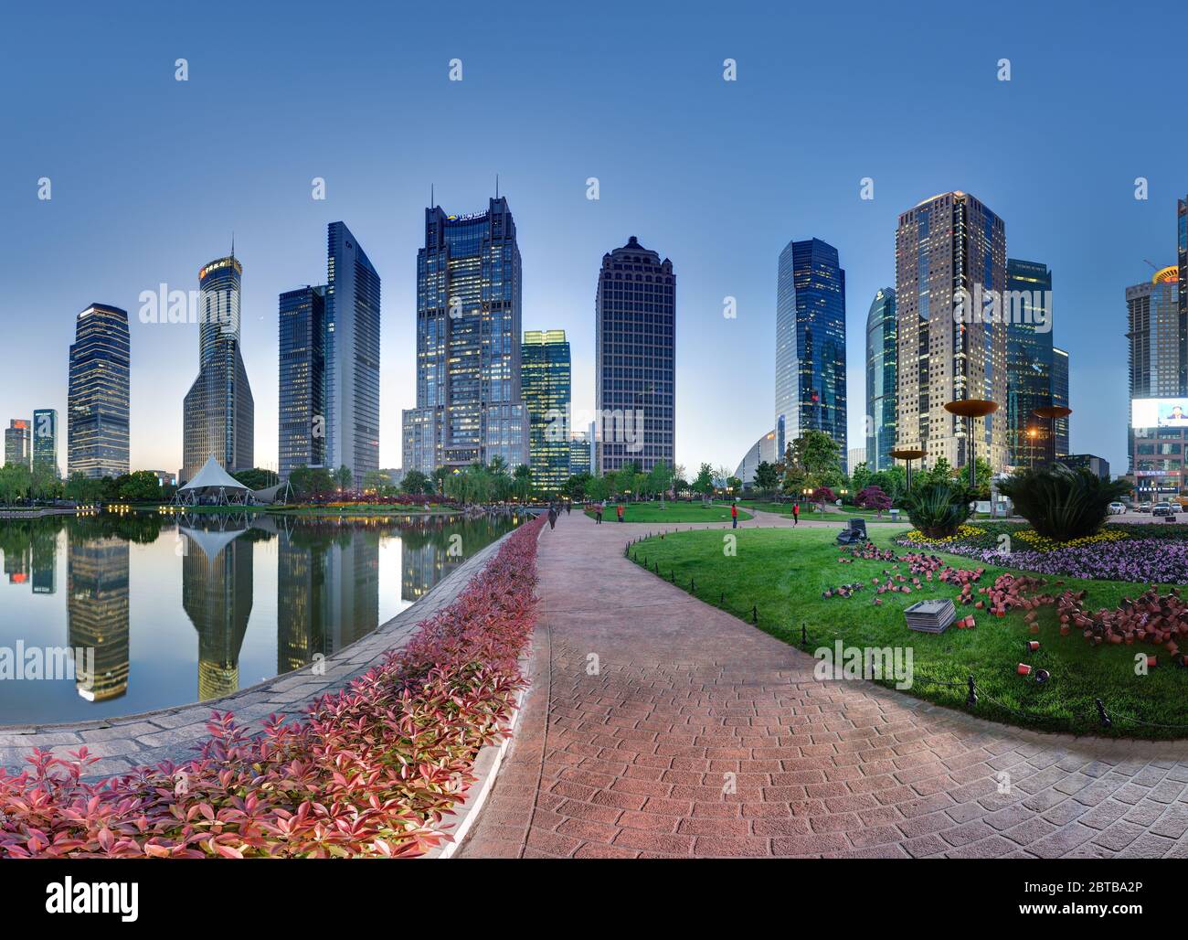 SHANGHAI, CHINA - APRIL 21, 2015: Skyline of Pudong financial center at dusk. Famous towers are visible in water reflection. Right part, can be combin Stock Photo