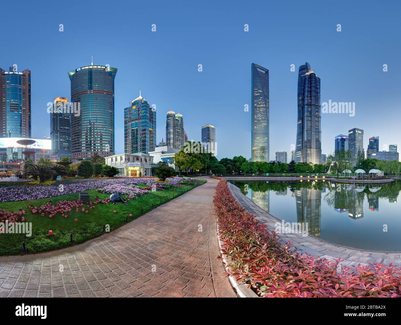 SHANGHAI, CHINA - APRIL 21, 2015: Skyline of Pudong financial center at dusk. Famous towers are visible in water reflection. Left part, can be combine Stock Photo