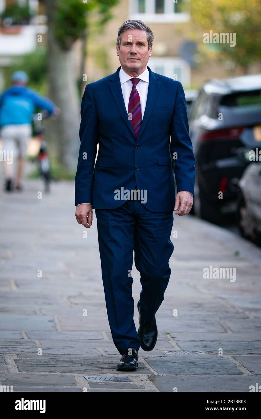 Labour leader Sir Keir Starmer issues a statement outside his home in north London, after Prime Minister Boris Johnson backed his de facto chief-of-staff Dominic Cummings following allegations he breached lockdown restrictions, as Mr Cummings had driven from his London home to Durham in March after his wife started displaying Covid-19 symptoms becoming fearful there would be no-one to look after his four-year-old child if he also took ill. Stock Photo