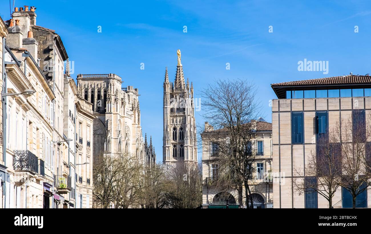 Bordeaux in France, the beautiful Pey Berland tower in the center, in a typical street Stock Photo