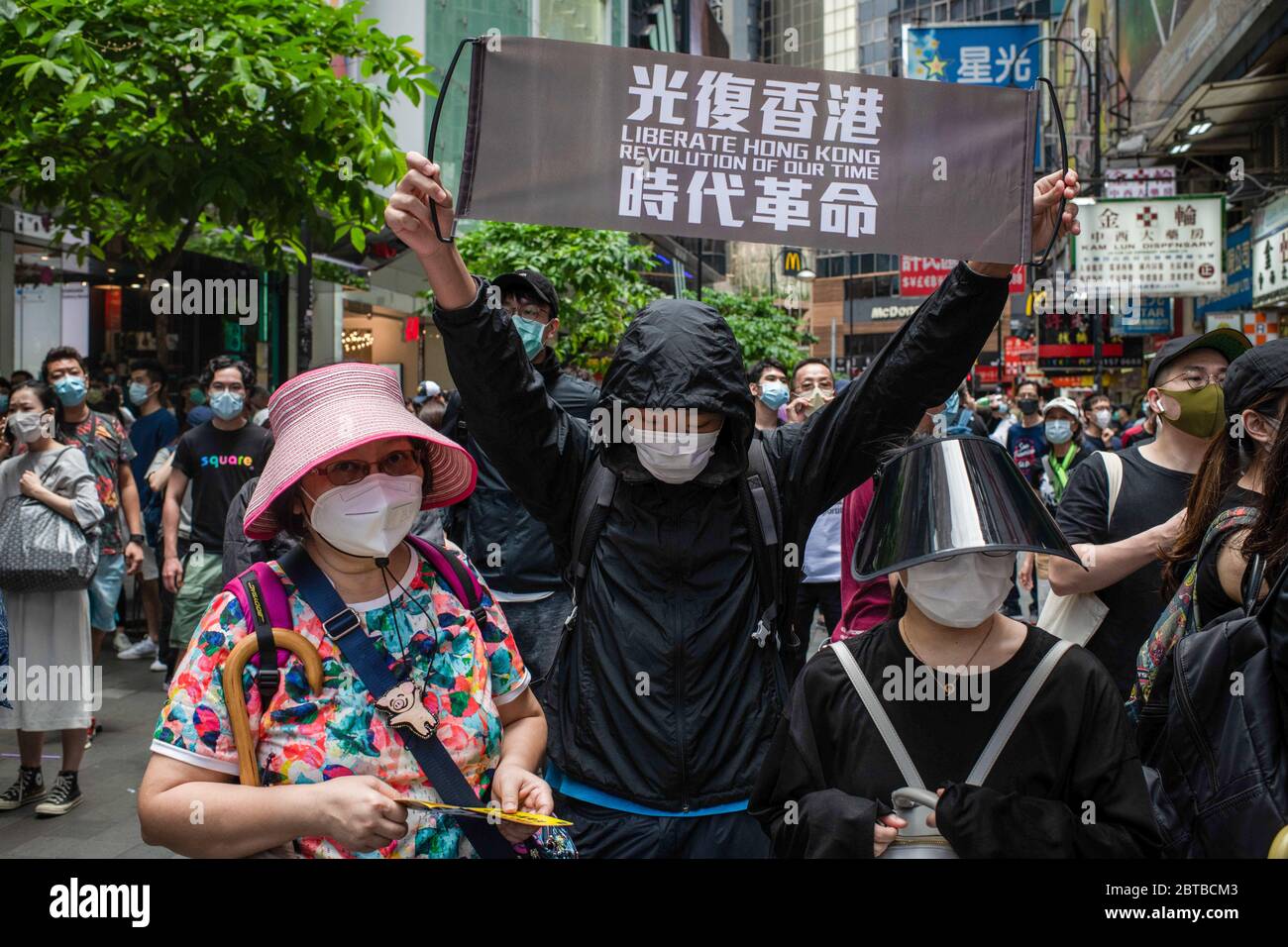 A protester raising a banner with a proindependence message during