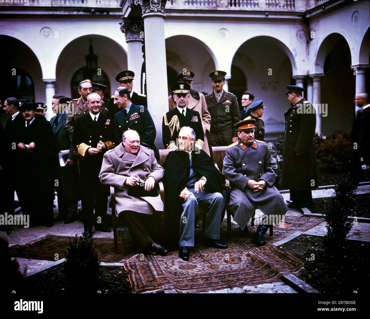 1945 , february, YALTA, CRIMEA, RUSSIA :The Yalta Conference was the World War II meeting of the heads of government of the United States, the United Kingdom, and the Soviet Union. With (from left to right) Winston Churchill , Franklin Delano Roosevelt and Joseph Stalin . Also present are USSR Foreign Minister Vyacheslav Molotov (far right), Field Marshal Alan Brooke , Admiral of the Fleet Sir Andrew Cunningham ,  Marshal of the RAF Sir Charles Portal  (standing behind Churchill), George Marshall , Army Chief of Staff and Fleet Admiral William D. Leahy (standing behind Roosevelt). Far Left: Si Stock Photo