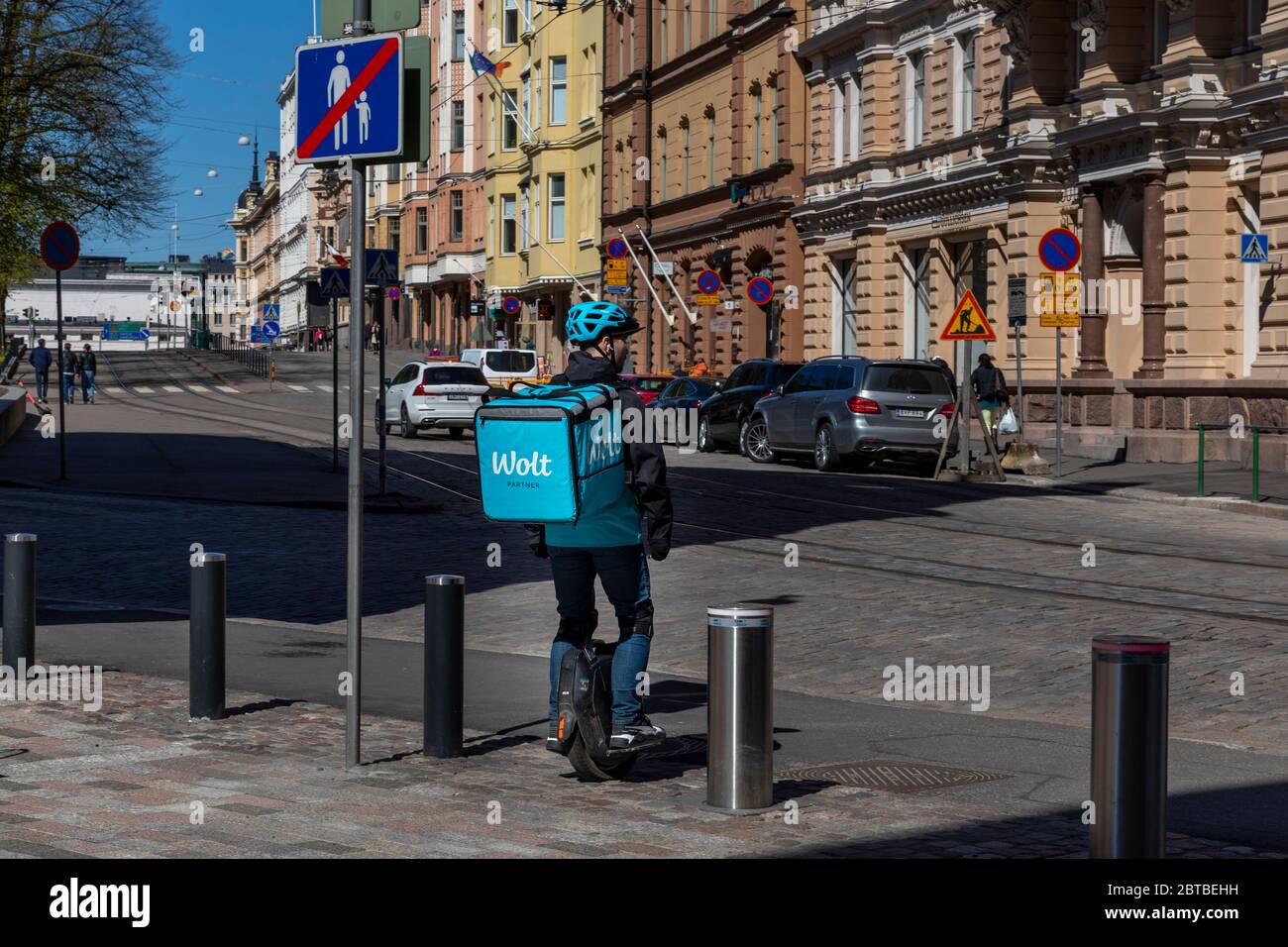 Coronavirus pandemic has increased food deliveries in Finland. Also solowheels are used as mean of transportation in urban environment. Stock Photo