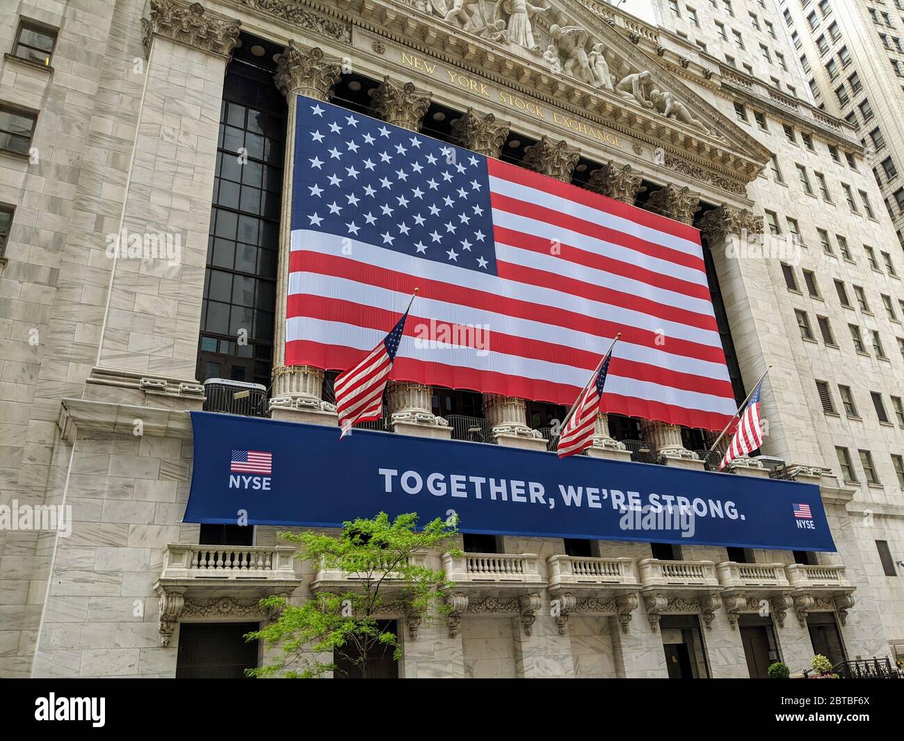 Sign on the New York Stock Exchange Building the day before the trading floor reopens after being closed indefinitely during the coronavirus pandemic in Lower Manhattan. Stock Photo