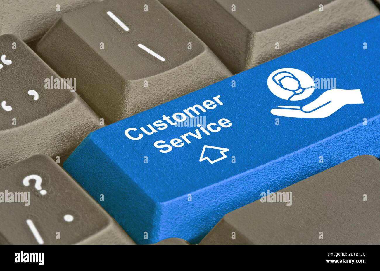 Keyboard with key for customer services Stock Photo - Alamy