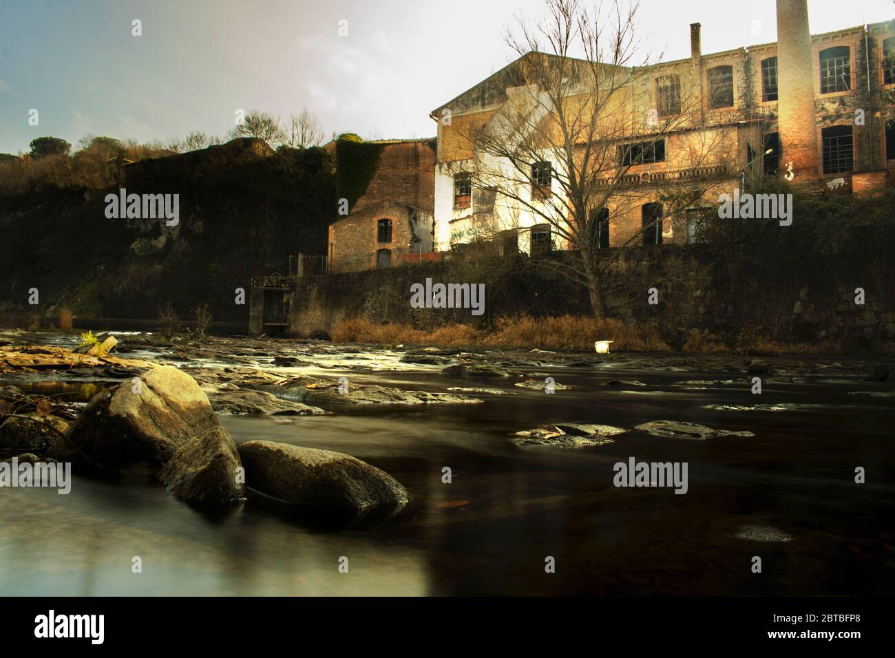 Old factory next to Ter rocky river in long exposure picture Stock ...
