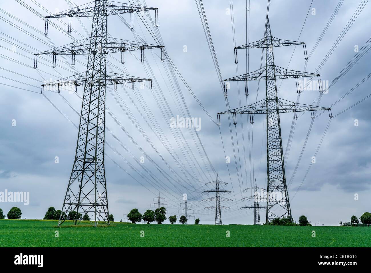 Power lines, extra-high voltage grid, 380 kilovolt, transports the electricity generated in large power plants to the regions, to a transformer statio Stock Photo