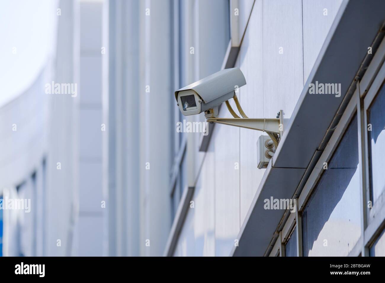 CCTV outdoor camera on a wall Stock Photo