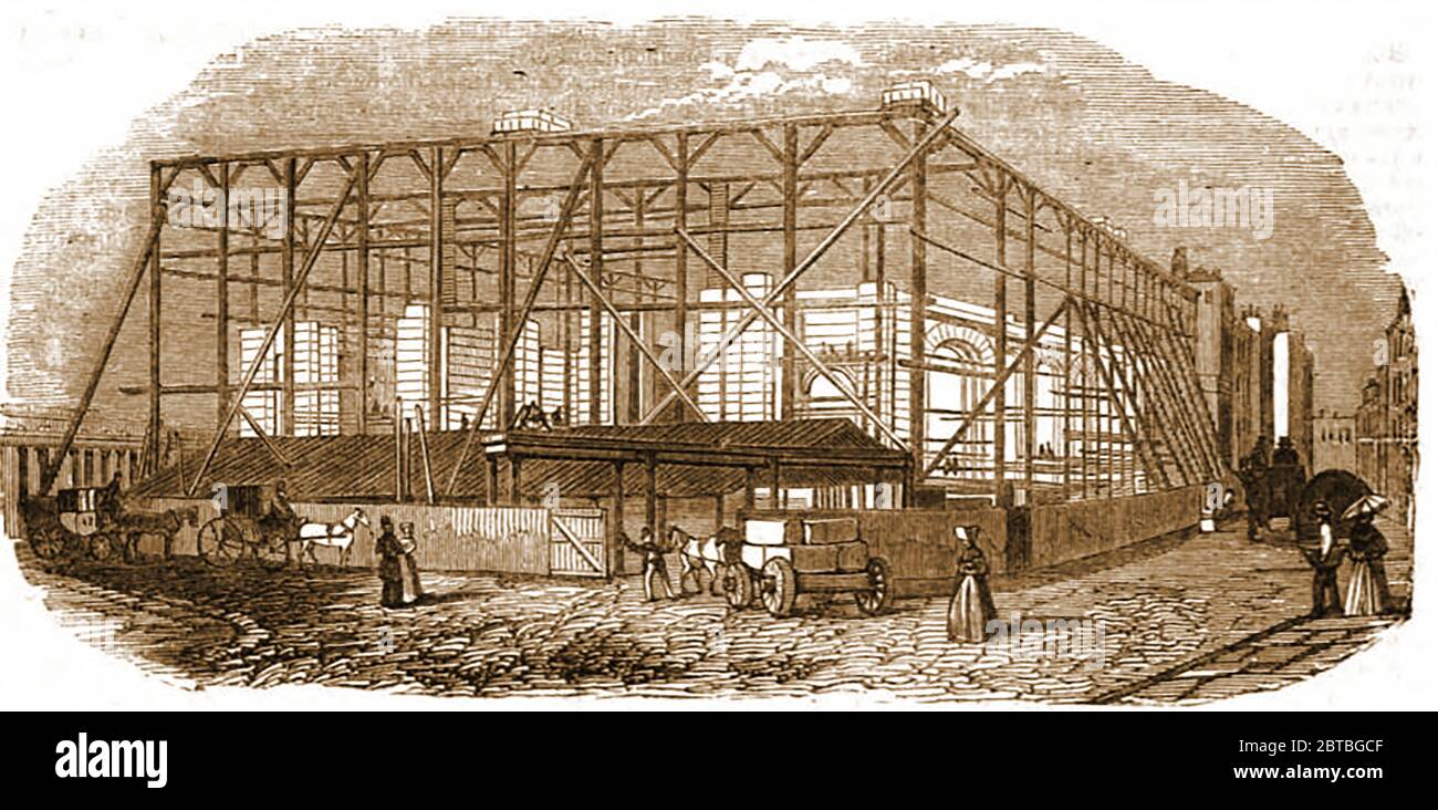 The Royal Exchange London, England, under construction in 1842. The first The Royal Exchange was founded as an assembly place for  merchants  by wealthy land mercer, Sir Thomas Gresham  It was opened by Queen Elizabeth I in 1571 and burnt down in the great Fire of London 1666.A new building opened 3 years later burnt down in 1669. The one in this illustration was  designed by William Tite and opened by Queen Victoria in 1844.  The internal work by Edward I'Anson  made use of concrete and was an early example of its use in architecture. Stock Photo