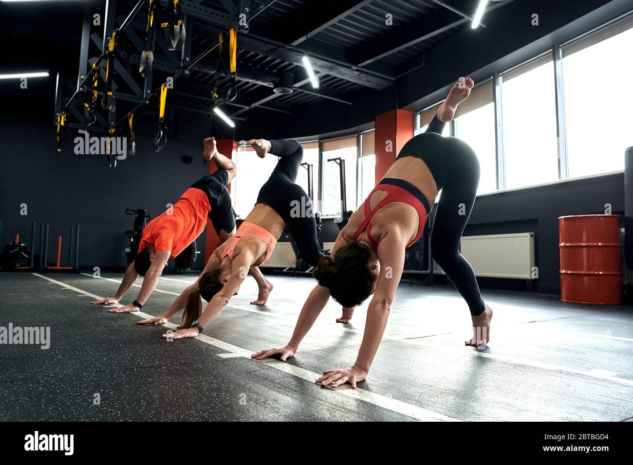 Animal Flow Class. Young people doing scorpion exercise concentrated Stock  Photo - Alamy