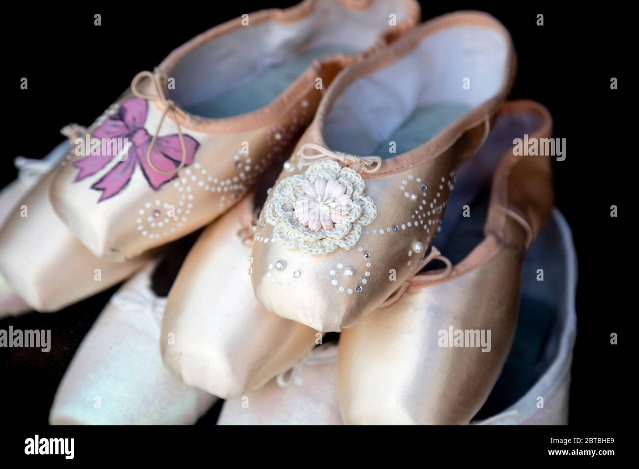 Ballet pointe shoes in the display at Freed of London dancewear shop in Covent Garden, London, UK Stock Photo