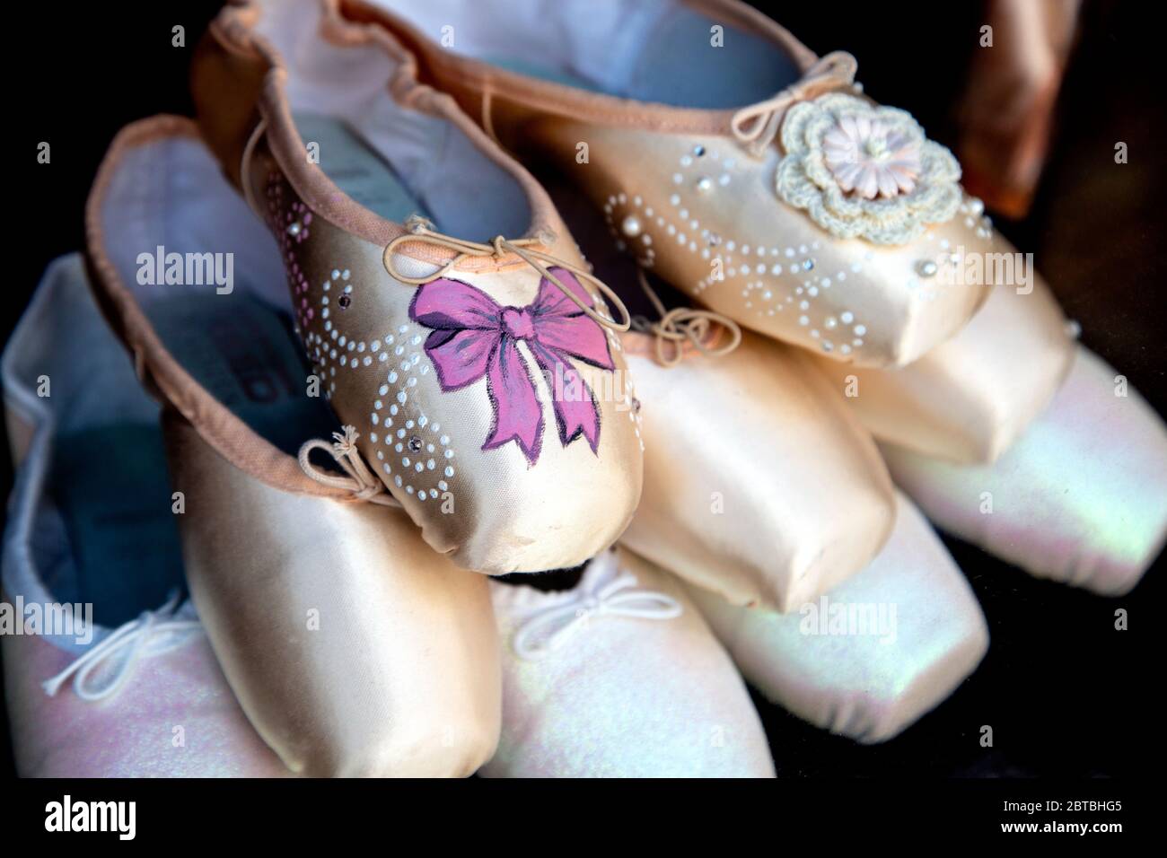 Ballet pointe shoes in the display at Freed of London dancewear shop in Covent Garden, London, UK Stock Photo