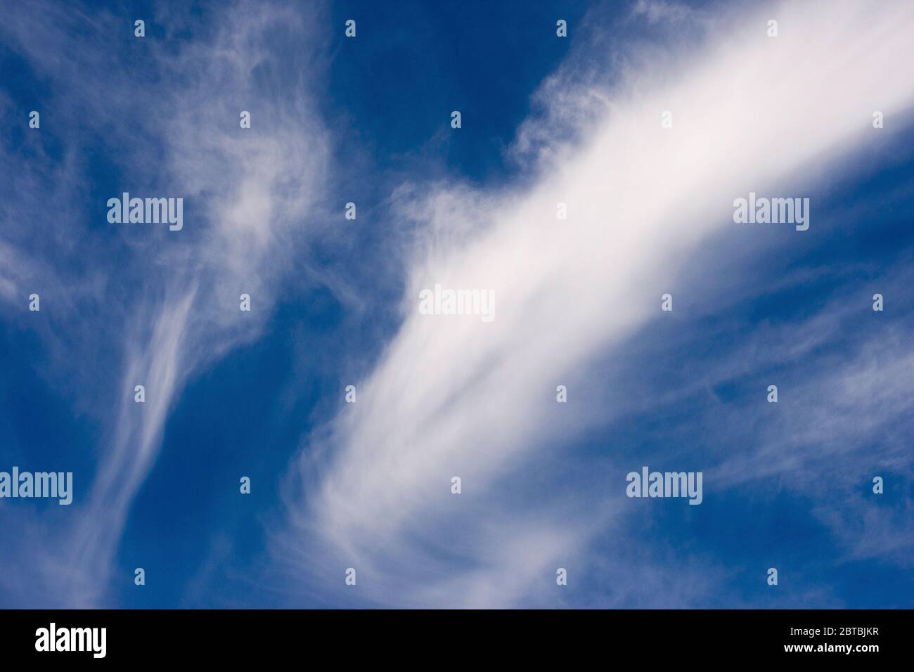 White wavy clouds in blue hi-res stock photography and images - Alamy