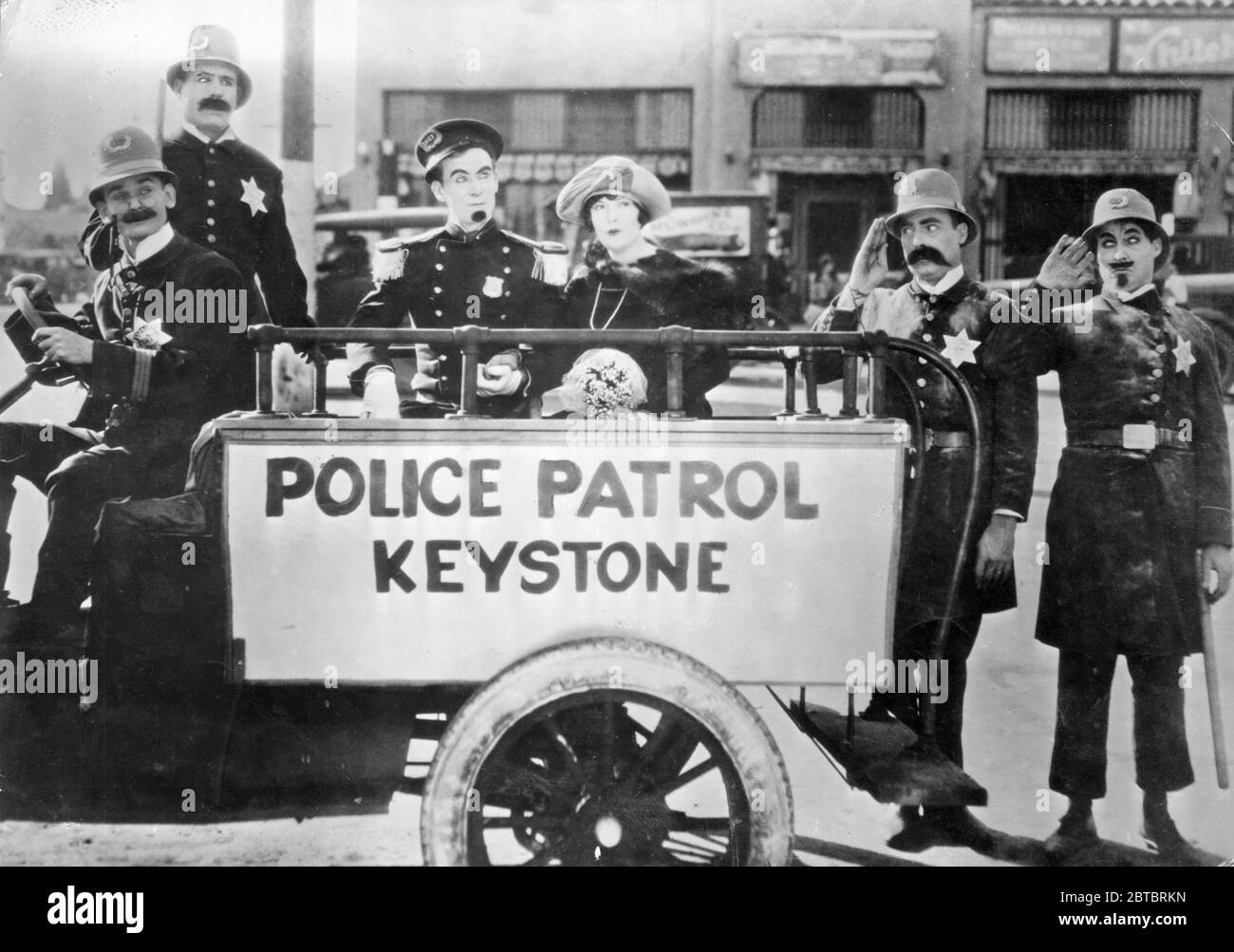 Keystone Cops, Tillie's Punctured Romance still from the 1914 Mack Sennett first full length silent movie with the iconic incompetent police and starring Mabel Normand and Charlie Chaplin Stock Photo