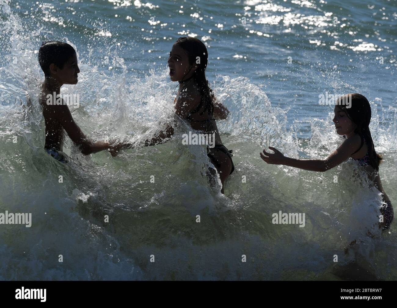 (200524) -- LADISPOLI (ITALY), May 24, 2020 (Xinhua) -- Children have fun at the seaside in Ladispoli, near Rome, Italy, May 24, 2020. A further 50 COVID-19 patients had died in the past 24 hours in Italy, bringing the country's death toll to 32,785, out of total infection cases of 229,858, according to fresh figures on Sunday. The number of recoveries rose to 140,479, an increase of 1,639 compared to Saturday. (Xinhua) Stock Photo