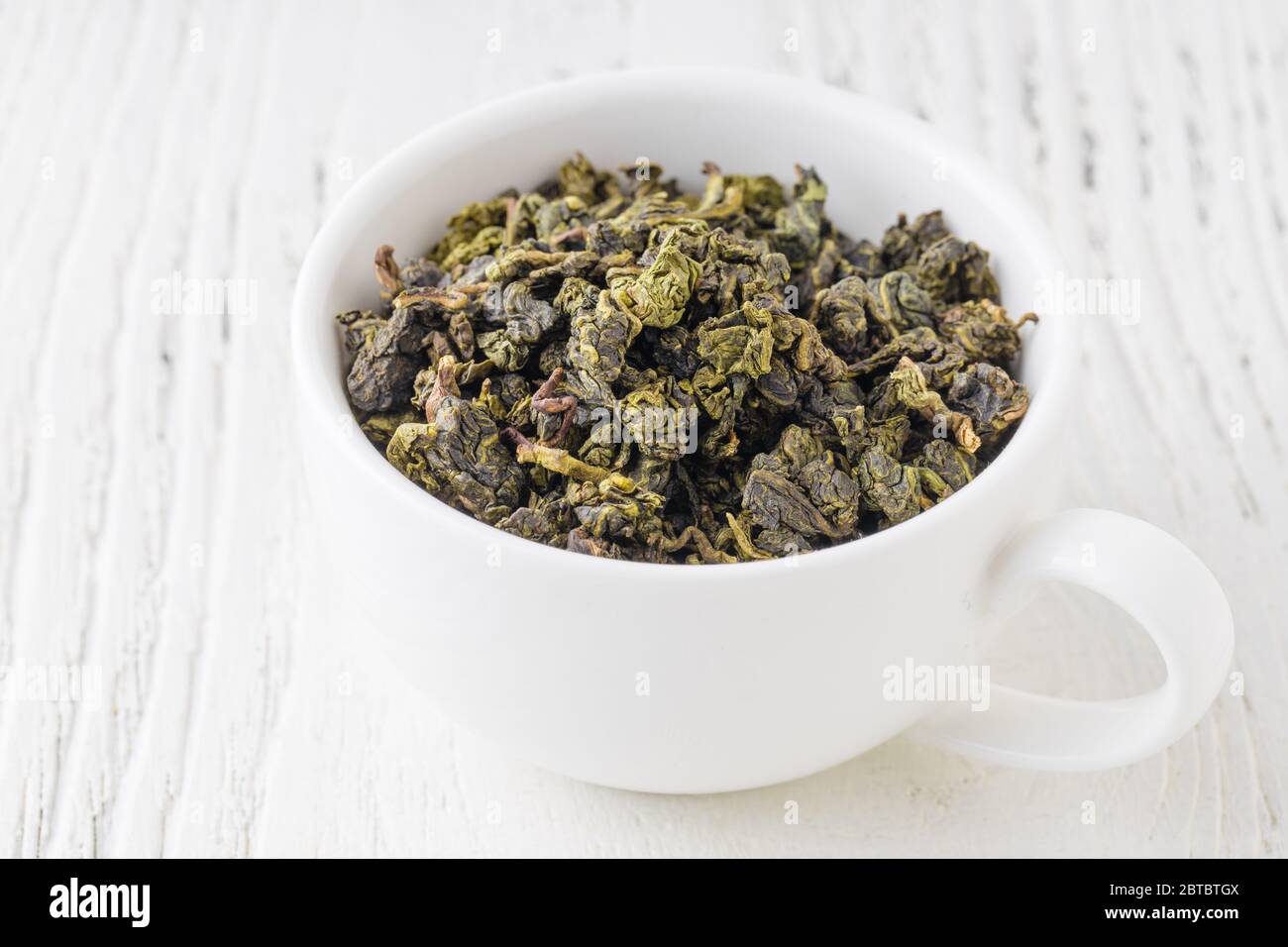 Green tea in a white cup Stock Photo Alamy