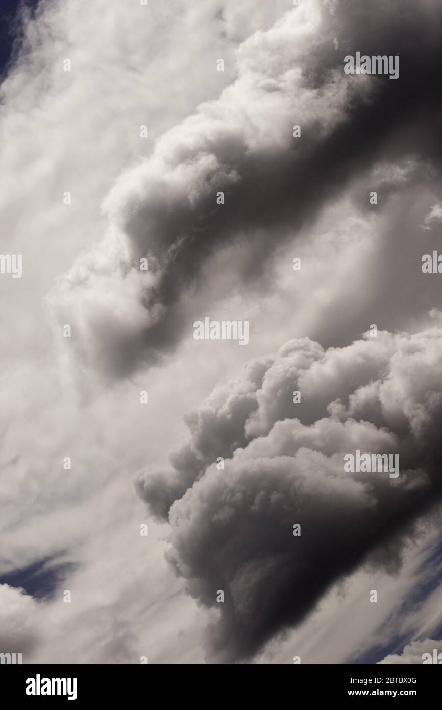 Fluffy white and grey clouds hi-res stock photography and images - Alamy