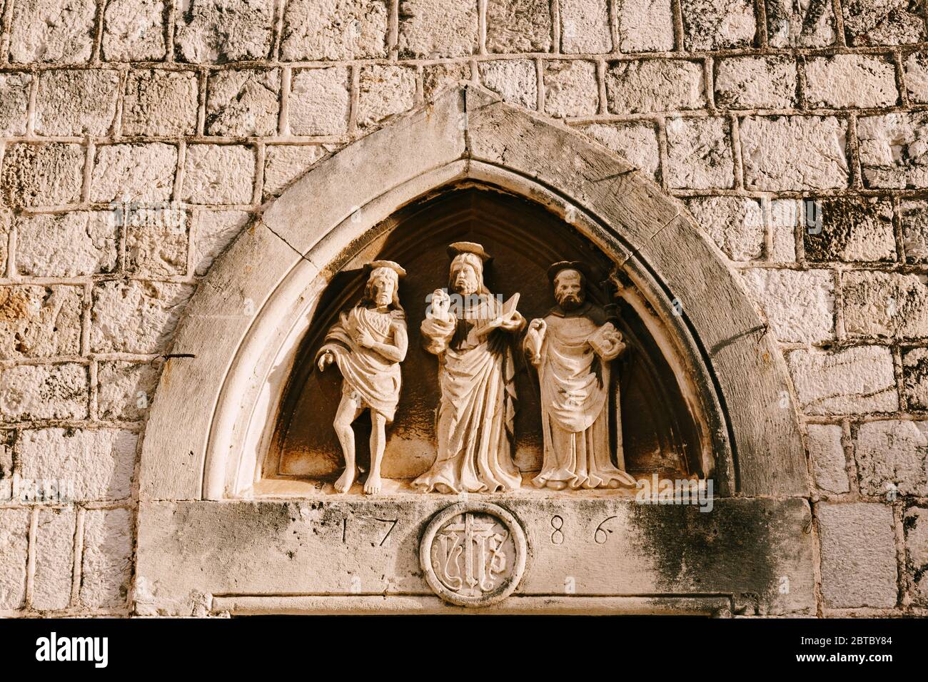 Close-up stone statues, bas-reliefs and high reliefs on the walls of the old city of Dubrovnik, Croatia. Stock Photo