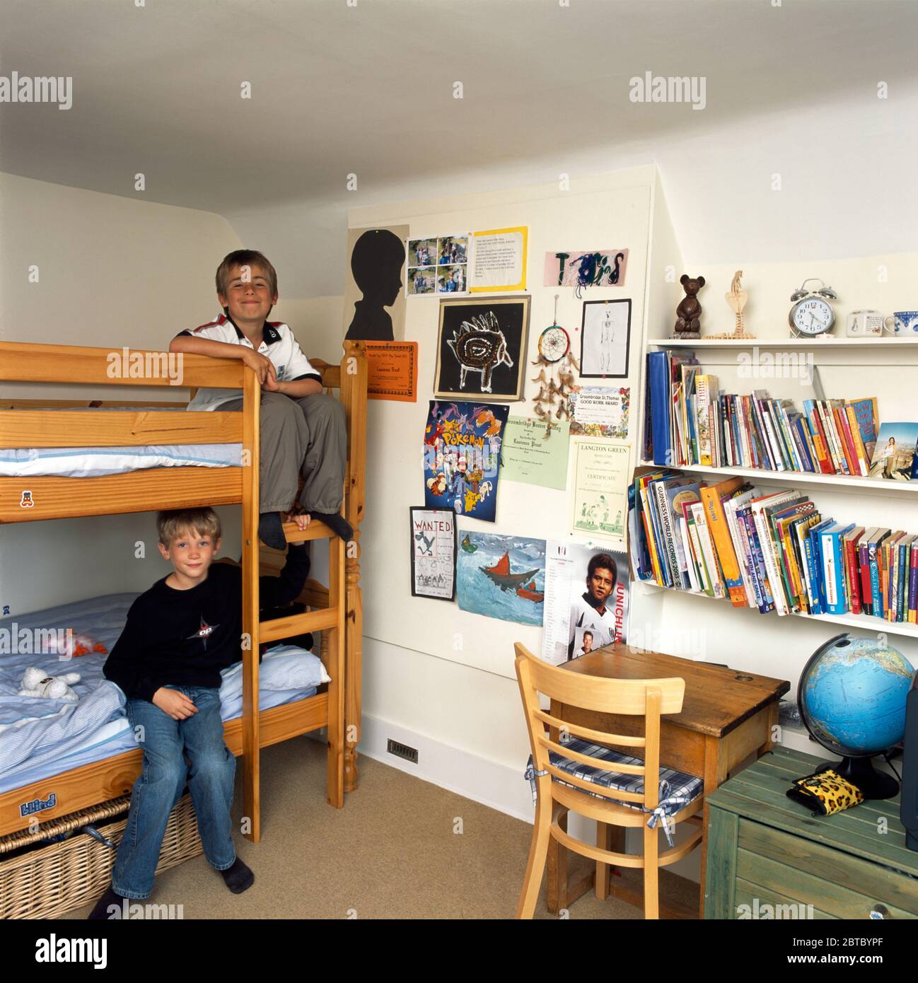 EDITORIAL USE ONLY   Boys sitting on bunk beds EDITORIAL USE ONLY Stock Photo