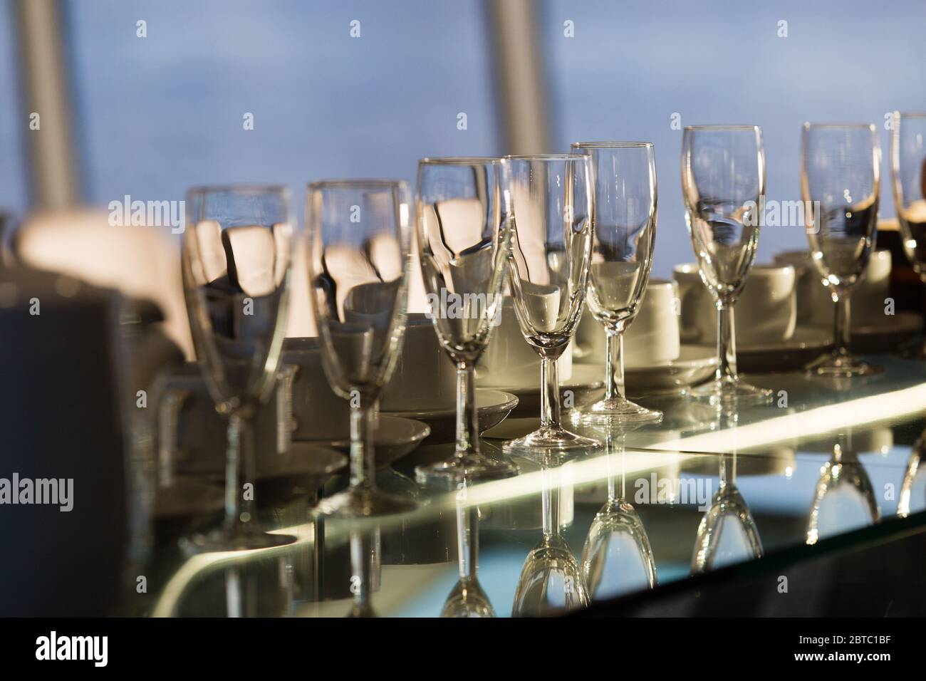 Champagne glasses onboard Thames Clippers Stock Photo