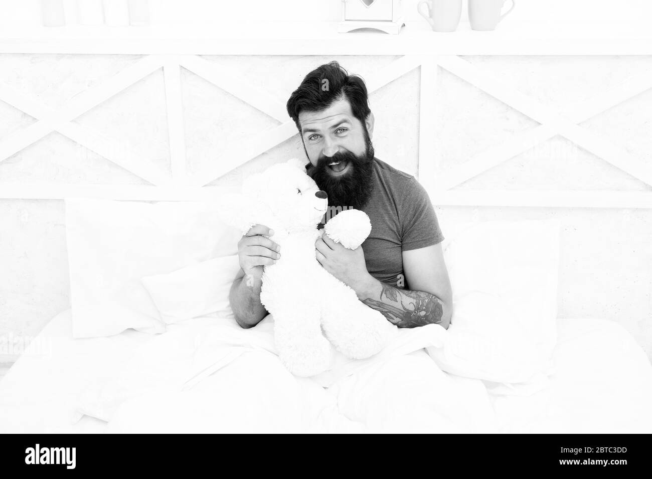 Perfect day. Gift for holidays. nice present for you. Valentines day gift for beloved. my birthday. Happy adulthood. shopping online concept. Love and kindness. bearded man teddy bear in bed. Stock Photo