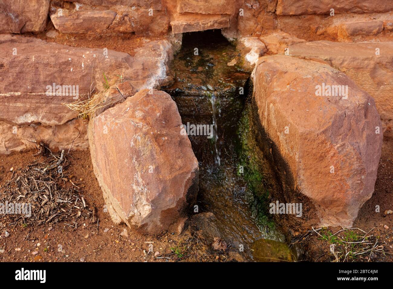 AZ00378-00...ARIZONA - Pipe Spring draining out of a building named 'Winsor Castle' preserved in Pipe Spring National Monument. Stock Photo
