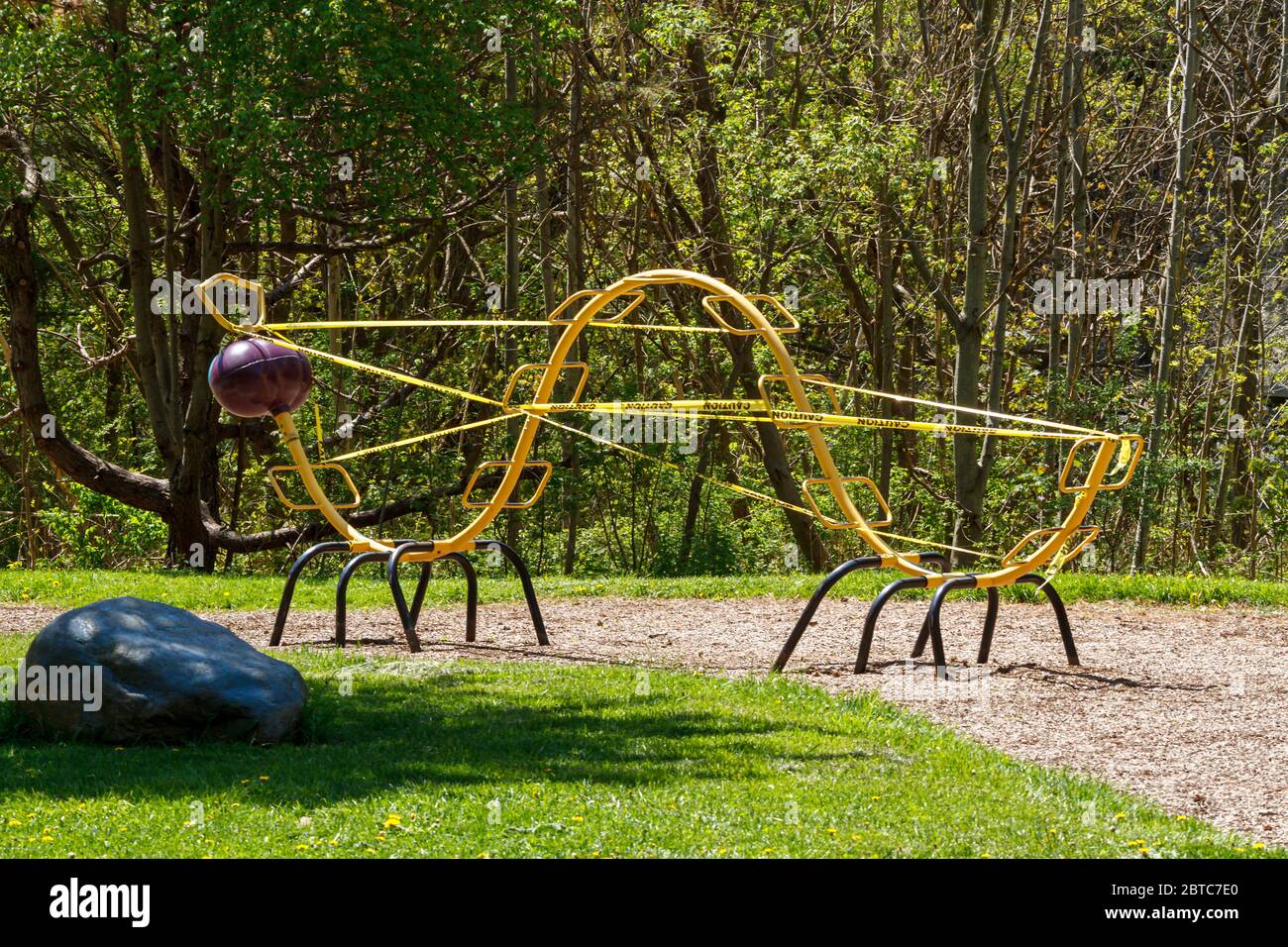 Playground Equipment taped off to prevent close contact Stock Photo