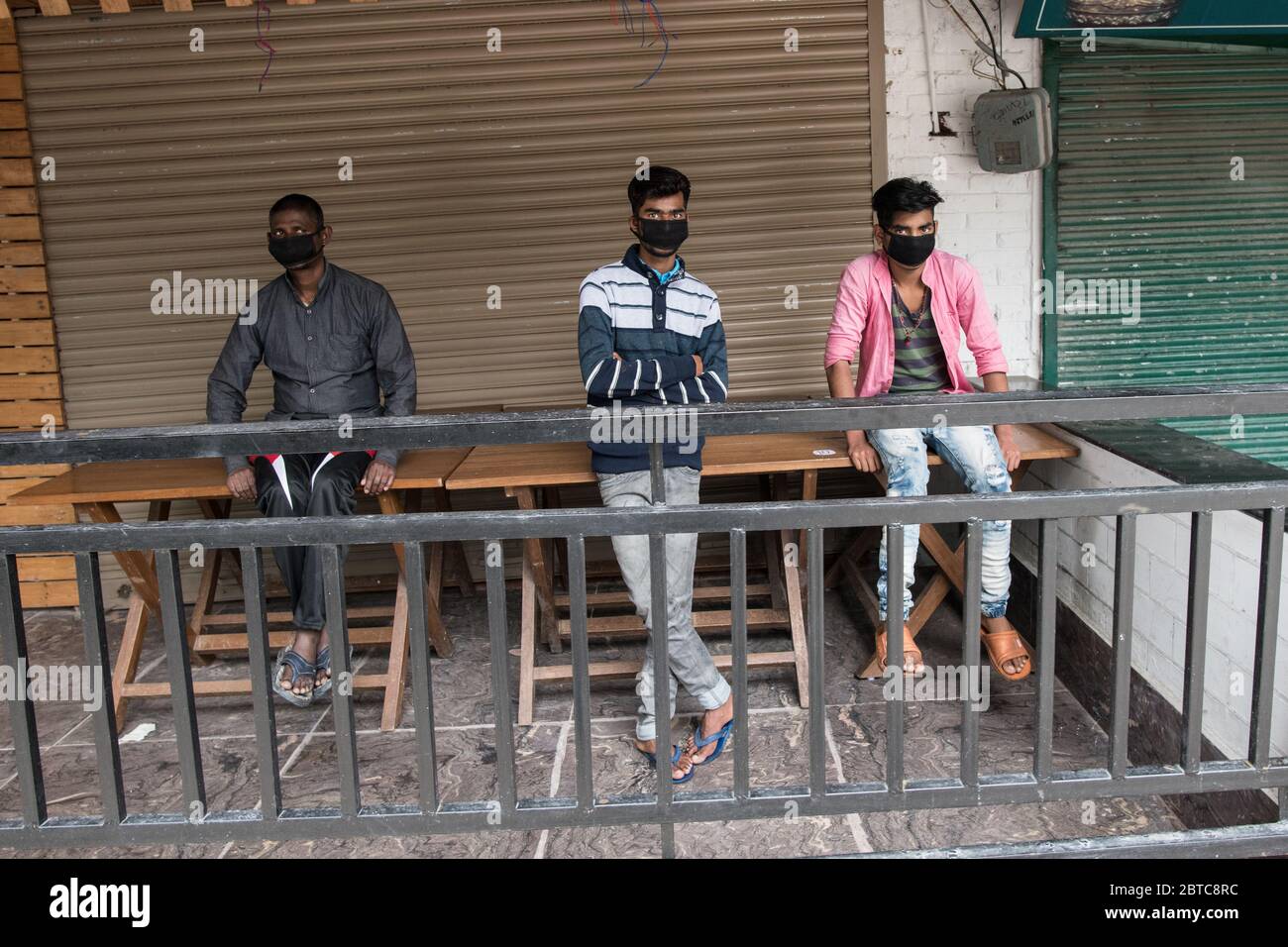 People wearing protective mask and social distancing to prevent the spread of coronavirus COVID 19. Dharamshala, India. Stock Photo