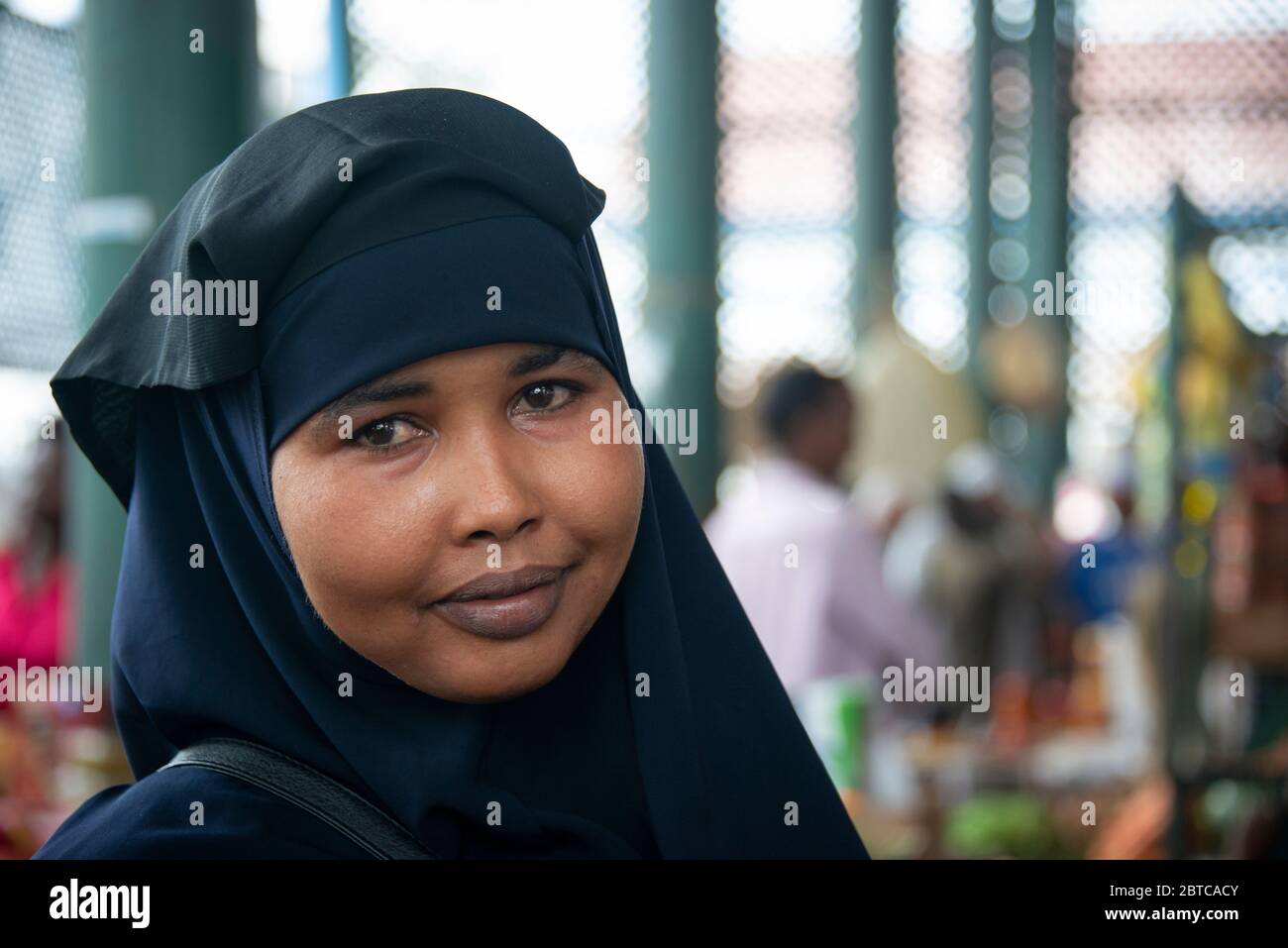 Smiling Muslim woman at the Mombasa public market Stock Photo