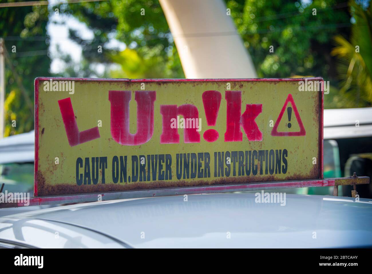 Funny sign on car about learning to drive Stock Photo