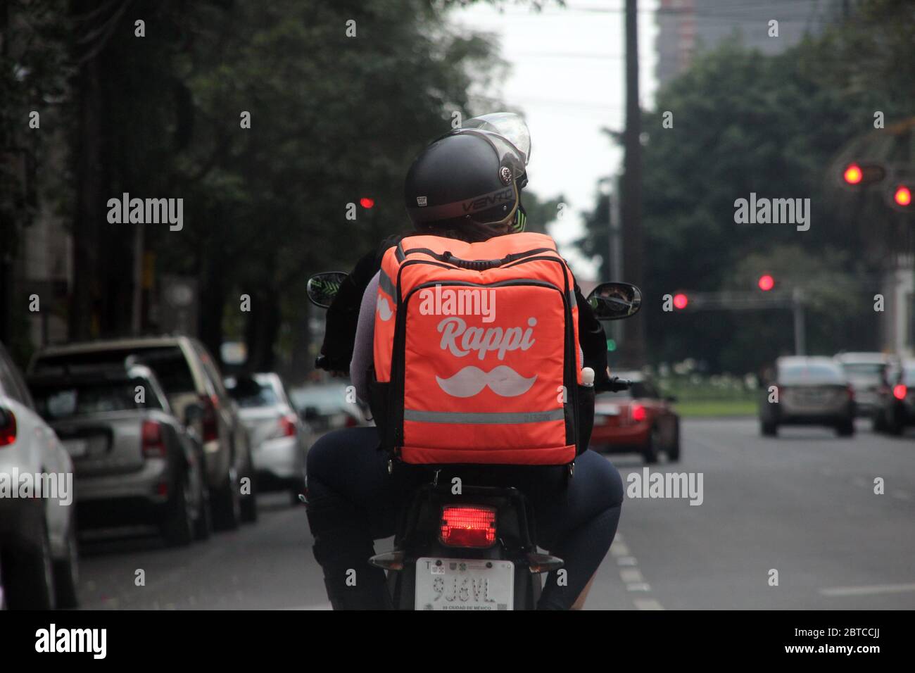 Delivering food in Mexico City. Covid-19 in Mexico. Stock Photo