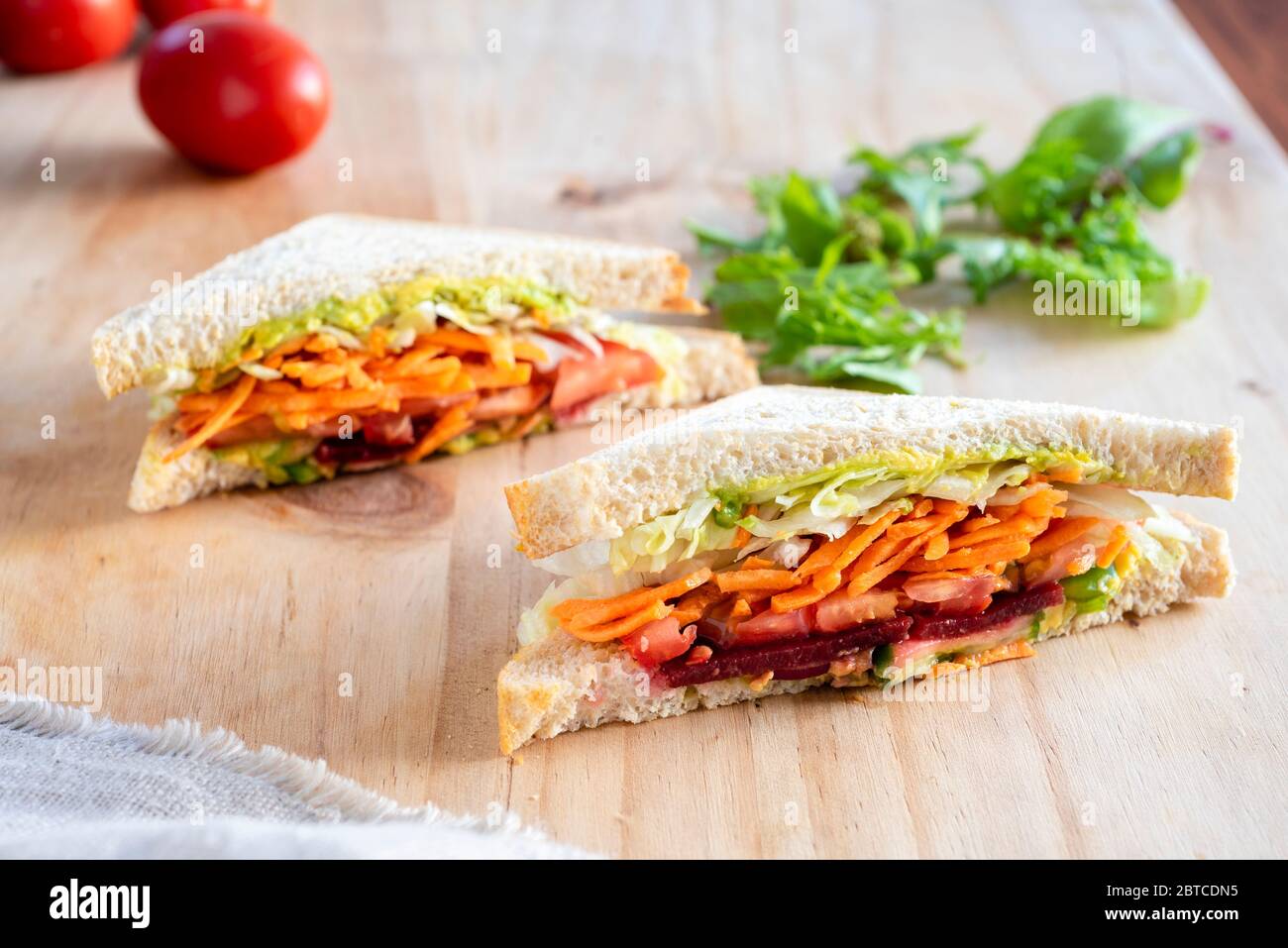 Salad sandwich with carrot, lettuce, tomato and beetroot on whole meal