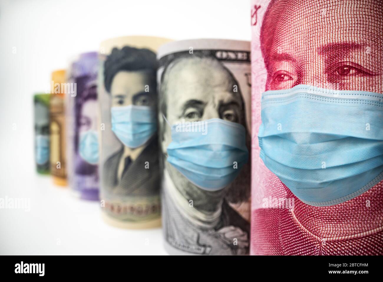 International currency money include US American Dollar, Euro Currency, British UK Pound, Australian Dollar, China Yuan and Japan Yen face mask concep Stock Photo