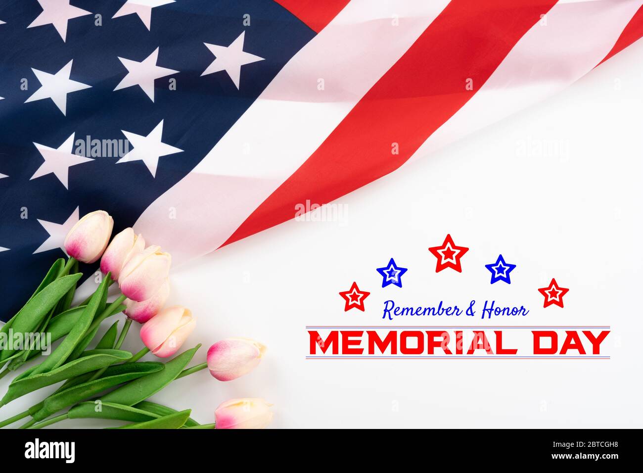 US American flag with tulip flower on white background. For USA Memorial day,  Memorial day. Top view with memorial day text. Stock Photo