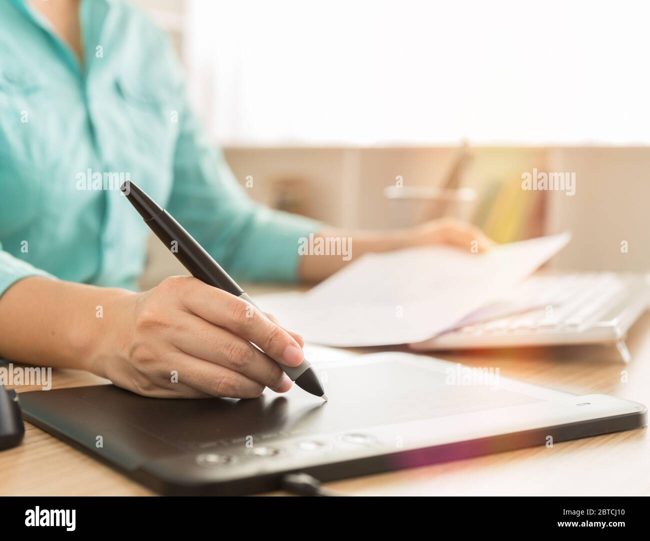 designers hand use mouse pen and computer working on new projects Stock Photo