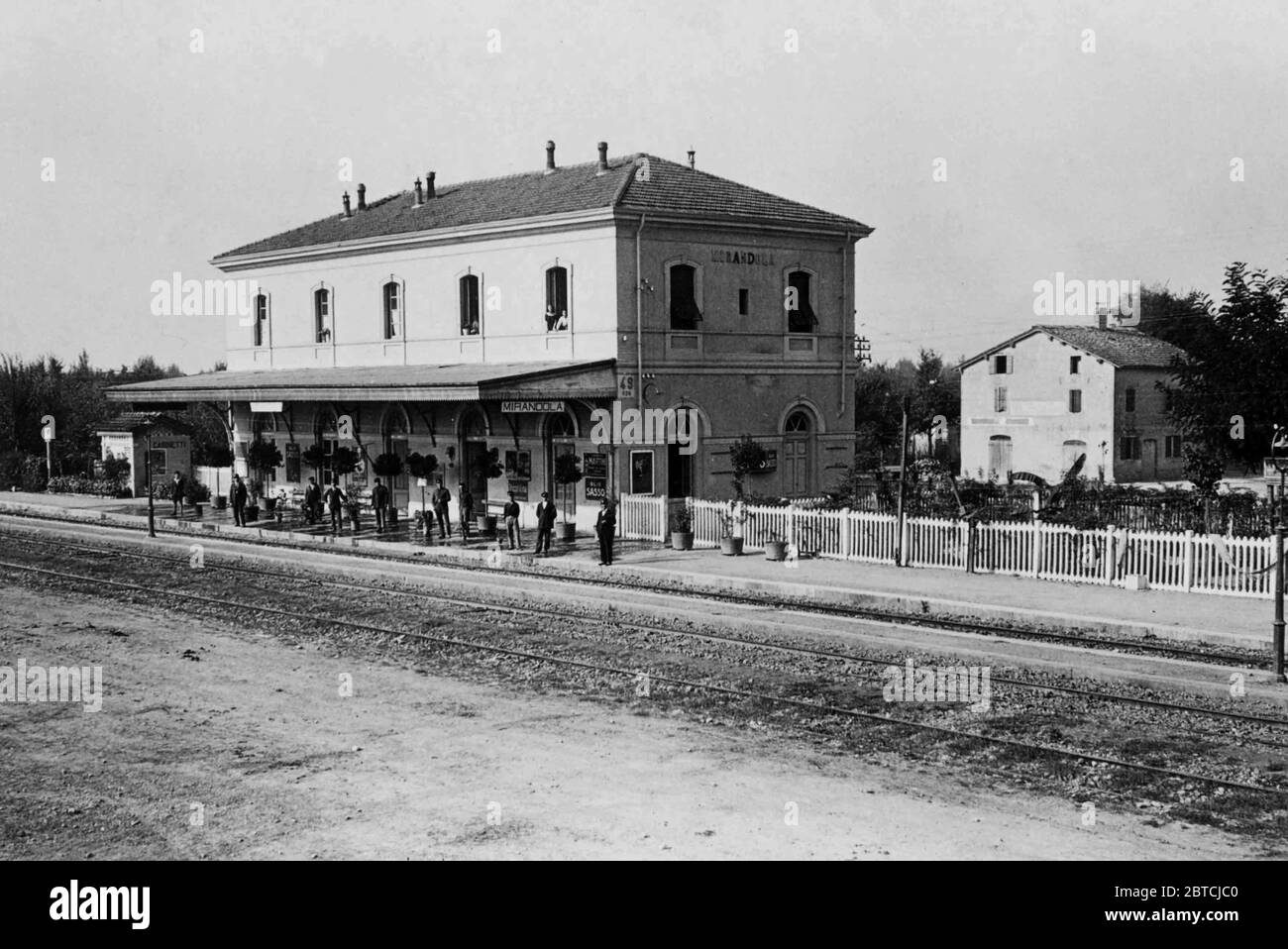 People wiating on a train at Cividale train station in Mirandola Italy ca. 1930 Stock Photo