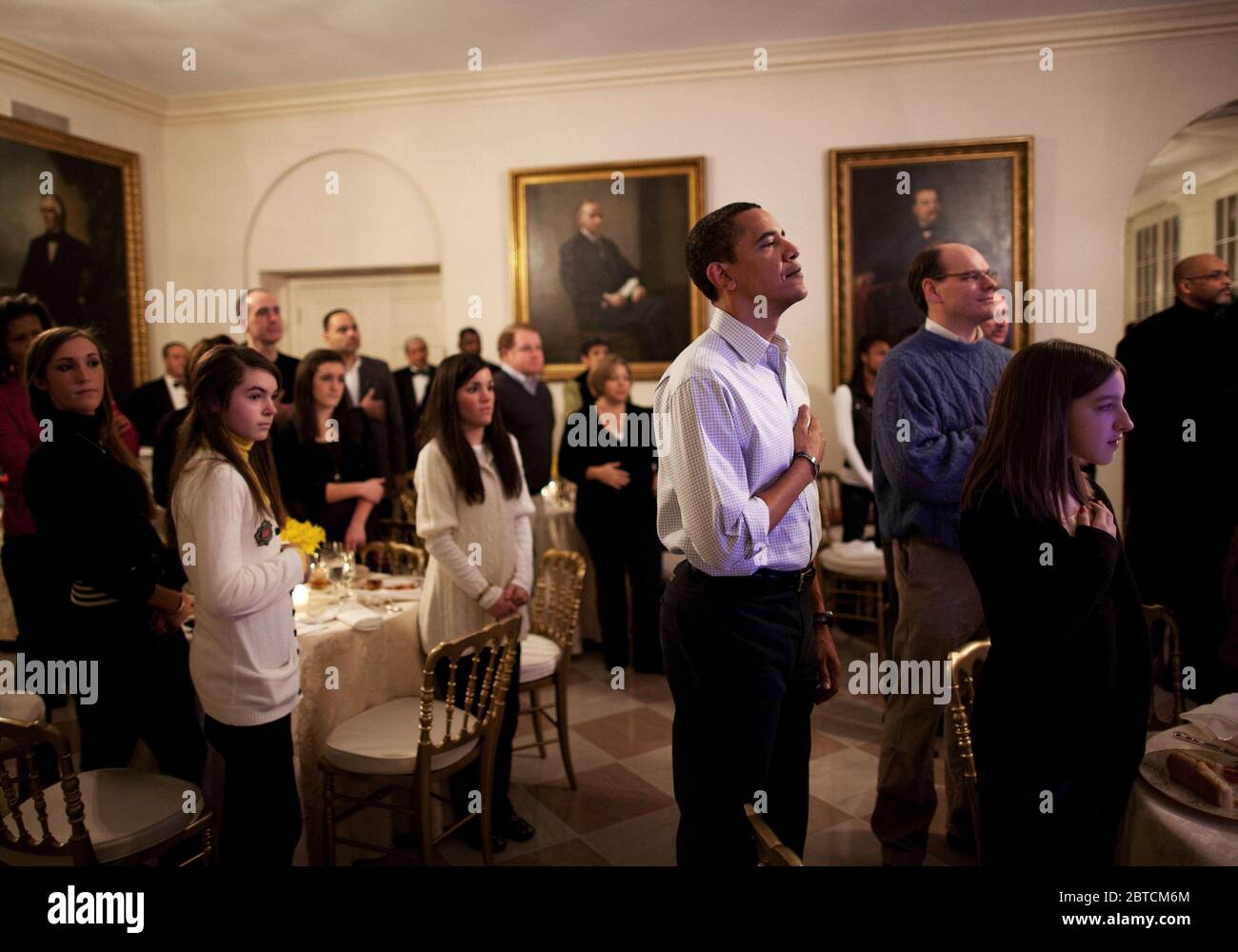 President Barack Obama with his hand on his heart as the National Anthem is played, prior to Super Bowl game kickoff, Arizona Cardinals vs. Pittsburgh Steelers in the East Garden Room of the White House 2/1/09. Stock Photo
