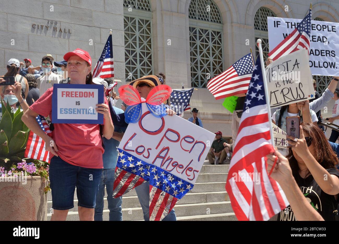 Los Angeles, United States. 25th May, 2020. Hundreds of President Trump supporters hold a 'Freedom Rally' calling to 'open California' on the steps of City Hall in Los Angeles on Saturday, May 24, 2020. Officials have said the lockdowns are needed to reduce the spread of the coronavirus. Photo by Jim Ruymen/UPI Credit: UPI/Alamy Live News Stock Photo