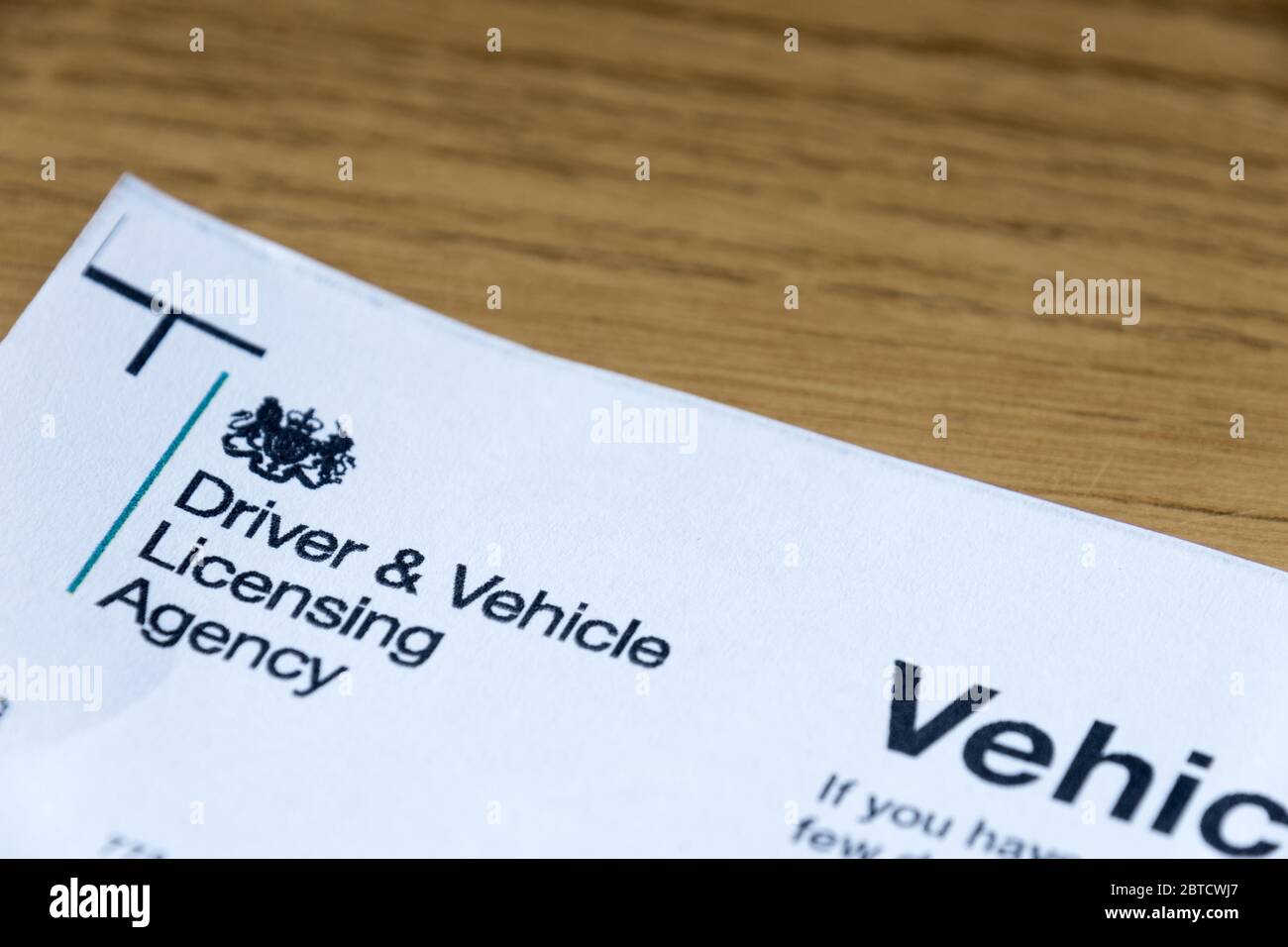 United Kingdom Driver and Vehicle licensing Agency letter and currency concept to pay money to government Stock Photo