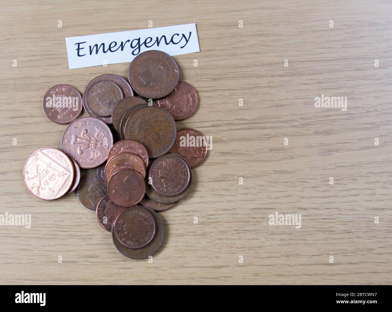 Coin saving in a jar as piggy bank towards emergency Stock Photo