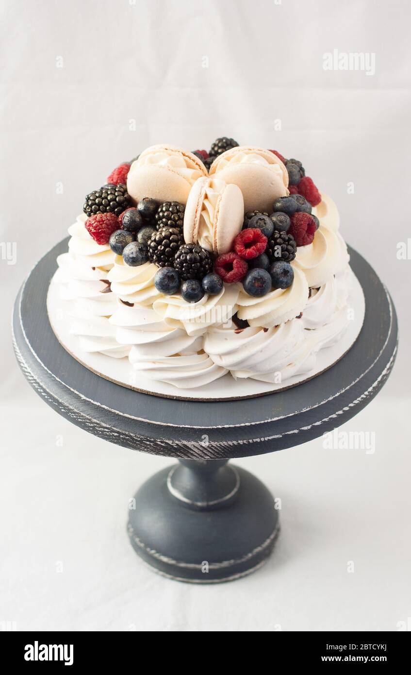 Pavlova Cake With Meringue Whipped Cream Adn Fresh Berries Decorated pavlova-cake-with-meringue-whipped-cream-adn-fresh-berries-decorated